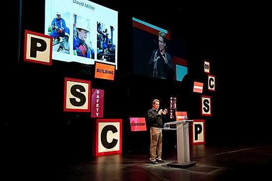 David Miller speaking on stage at a safety conference